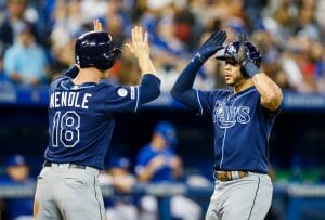 Two baseball players giving high fives