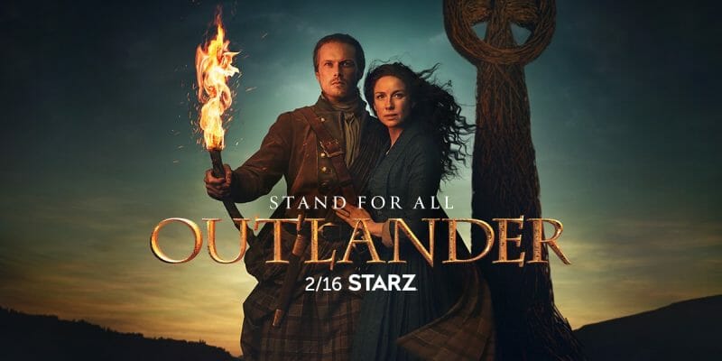 Two people walking in the dark